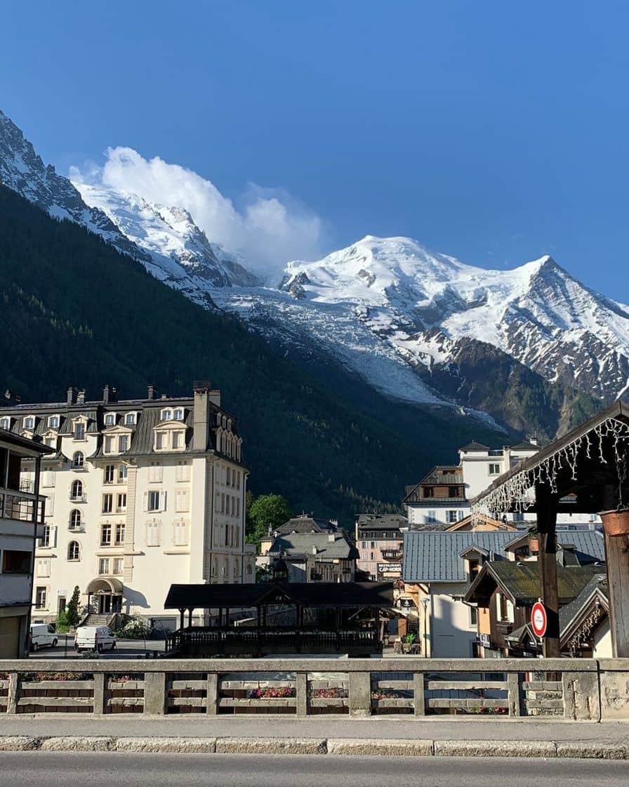 Belle Époque buildings in central Chamonix along the Arve, the snowy dome of Mont Blanc above the rooftops