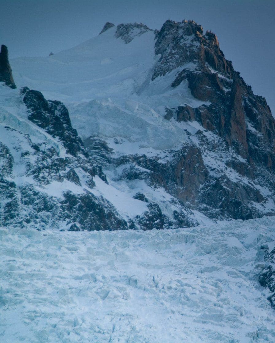 Icy summits and glacier in the blue light of dawn