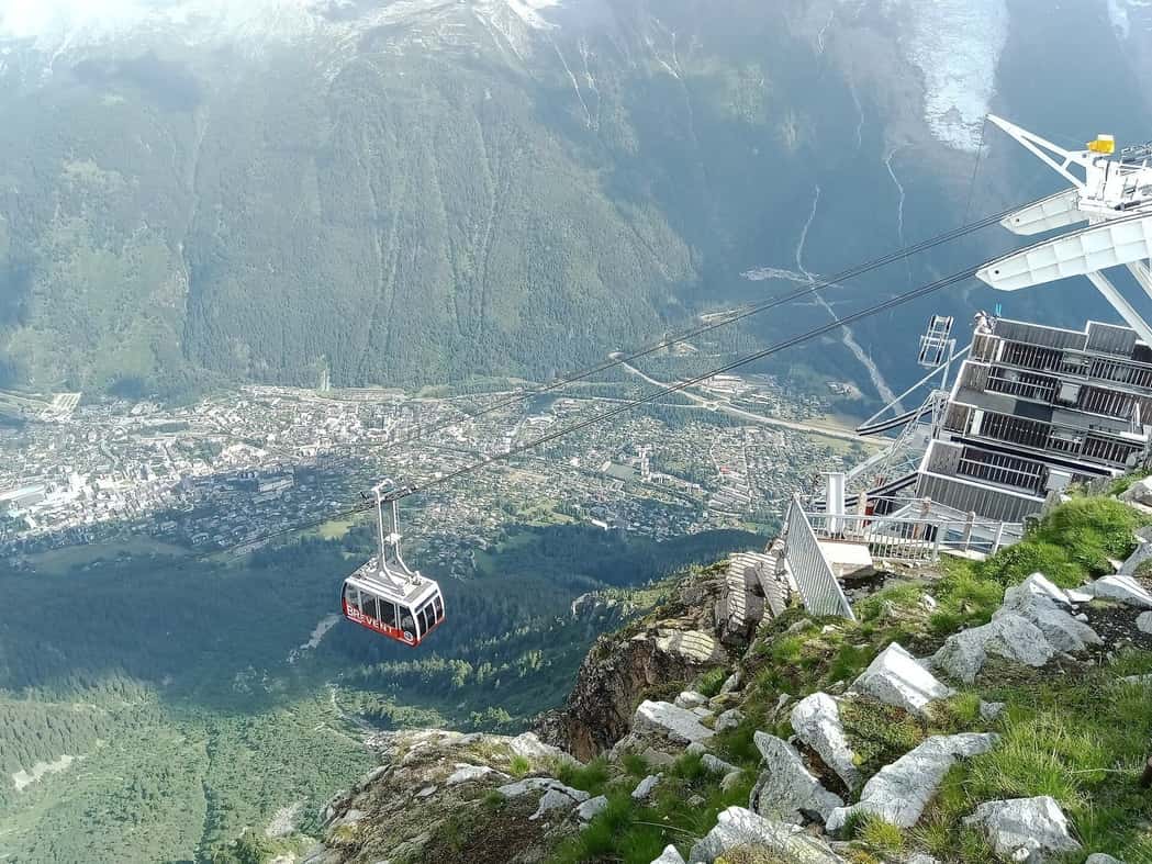 Brévent cable car cabin hanging above the valley, the town of Chamonix far below